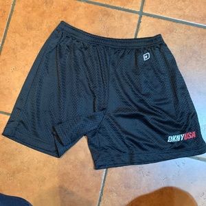 Women’s DKNY active black mesh UNLINED athletic shorts, elastic waist.